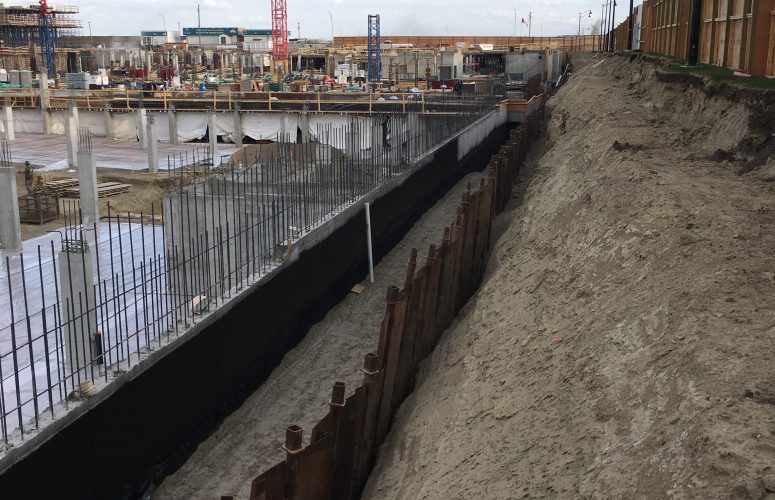 A 16' tall shoring wall installed along the edge of a large commercial project in Calgary, AB.